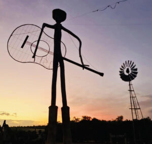 guitar cowboy and windmill boyup brook statue